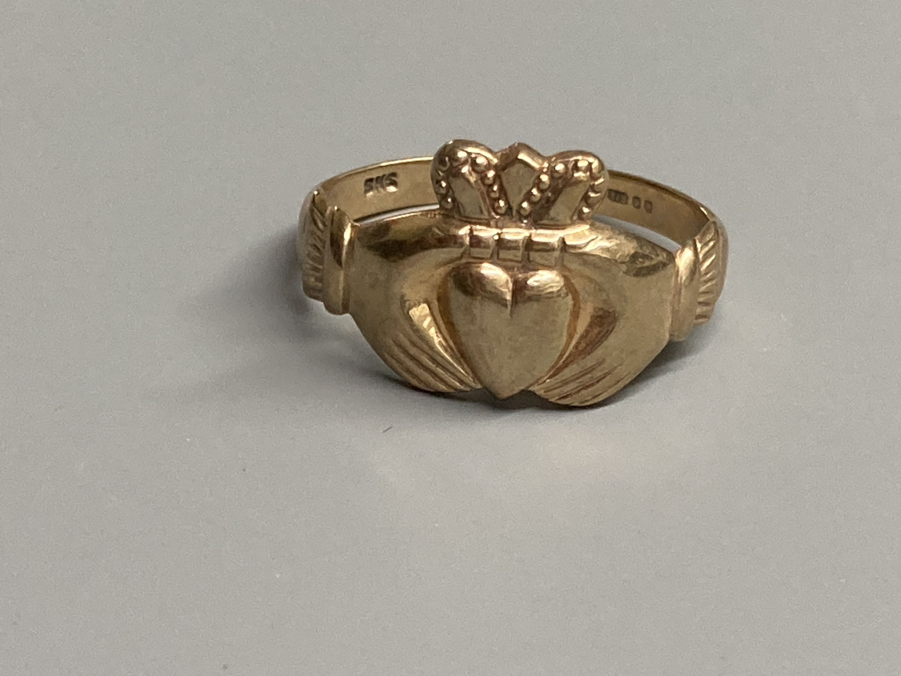 Four assorted modern 9ct gold rings including two claddagh rings